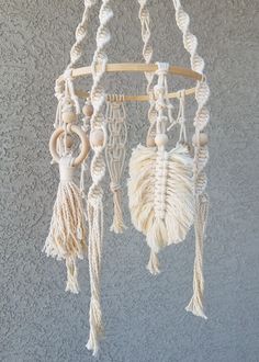 a white dream catcher hanging on the wall