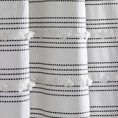 black and white striped curtains with tassels