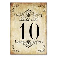 an old fashioned table number card with the numbers 10 and ten in black on it