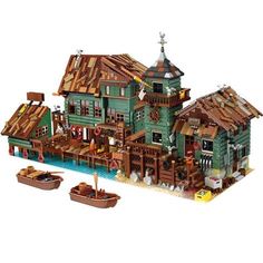 a lego boat is in front of a green house with two smaller boats on the water