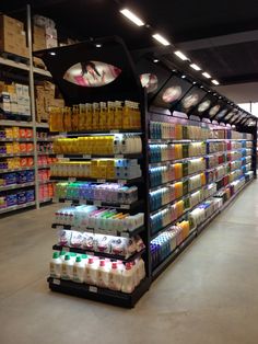 an aisle in a grocery store filled with lots of drinks