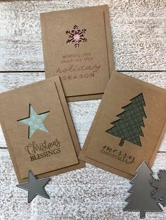 three christmas greeting cards on top of each other