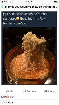 the ramen is being served in a glass bowl with noodles on it, and someone has