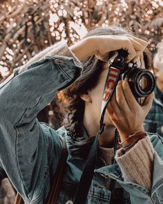 a woman taking a photo with her camera