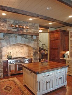 a large kitchen with an island in the middle