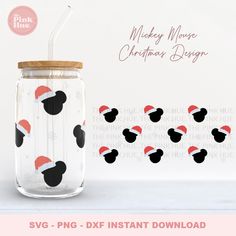 mickey mouse christmas designs in a mason jar with straw top and santa's hat