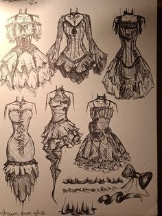 some drawings of dresses on a piece of paper