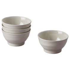 four white bowls sitting next to each other on top of a white tableware set