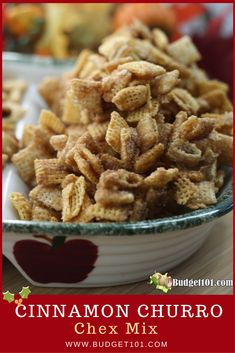 cinnamon churro chex mix in a bowl on a wooden table with an apple