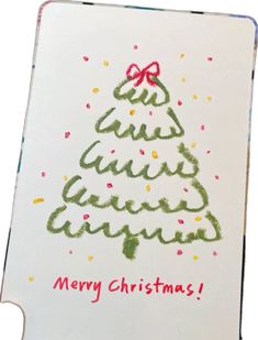 a christmas card with the words merry christmas written in green and red ink on it