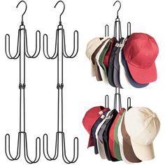 four hats hanging on hooks and one hat is attached to the wall with an iron hook