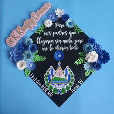 a graduation cap decorated with flowers and words