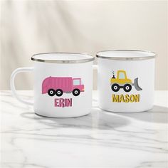 two personalized coffee mugs with construction trucks on them, one is pink and the other is yellow