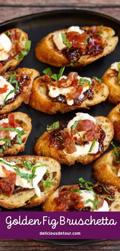 small breads with meat and cheese are on a black plate