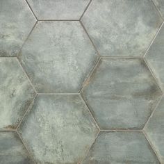 a tile floor with hexagonal tiles on it