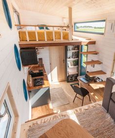 the interior of a tiny house with stairs