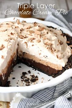 a chocolate cream pie with a slice missing from it