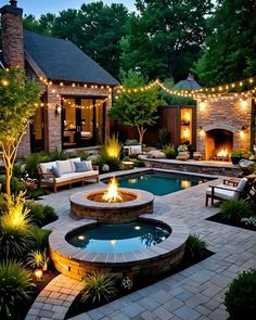 a backyard with a fire pit surrounded by landscaping lights and seating around the pool area