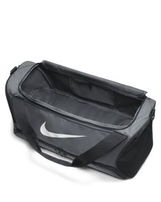 the nike duffel bag is black and grey