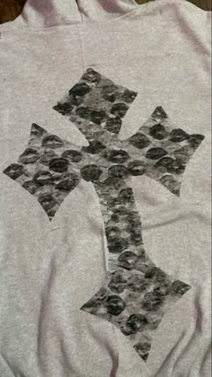 a white shirt with a cross drawn on it