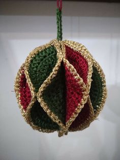 a crocheted ornament hanging from a string