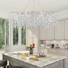 a chandelier hanging from the ceiling in a kitchen