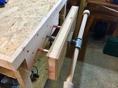 a close up of a bench made out of wooden planks and some screws