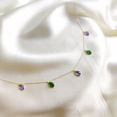 "This stunning pendant necklace is set in 14K Solid Yellow Gold with Natural Tanzanite and Green Aventurine with utmost precision. It is an unique gemstone pendant for nearly every occasion and is completely hassle-free jewelry. ITEM DETAILS * Gem: Tanzanite * Gem Size: 6X9mm * Gem Shape: Pear * Gem: Green Z * Gem Size: 6X9mm * Gem Shape: Pear * Total Gem Weight: 7.74 carats * Gold Purity: 14KT  * Gold Weight: 1.69 gram * Total Weight of the Pendant: 3.24 gram * Necklace Length: 18\" Inches The Gold purity is guaranteed and it comes with authentic 14KT gold hallmark. Since my items are handmade, they are absolutely nickel and lead free. CUSTOMIZATION * Gemstone customization is available and it can be substituted with a gem of your choice. Kindly message me for the same. PACKAGING * The Pe Tanzanite Pendant, Handmade Jewelry Box, Golden Rutilated Quartz, Bezel Necklace, Yellow Gold Necklace, Bezel Pendant, Natural Tanzanite, Unique Gemstones, December Birthstone