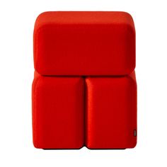 a red chair that is sitting on top of a white surface and it has two square seats