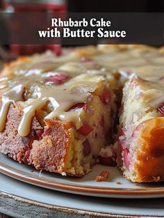 a close up of a cake on a plate with the words rhubarb cake with butter sauce