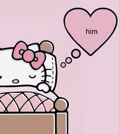 a hello kitty sitting on top of a bed next to a heart shaped balloon with the word him written above it