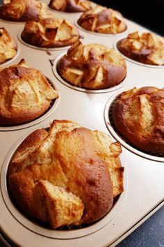 several muffins are sitting in a baking pan