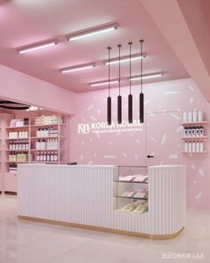 the interior of a store with pink walls