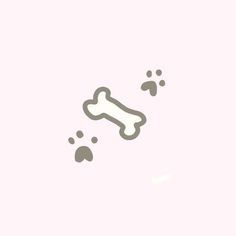 a dog bone and paw prints on a pink background