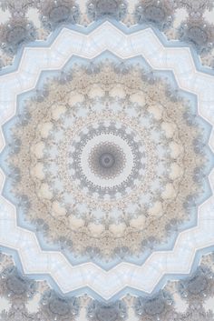 an intricate circular design with blue and white colors on the center, in shades of gray