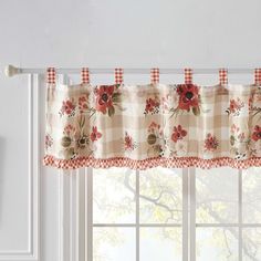 a kitchen window curtain with red flowers and gingham checkered valance on it