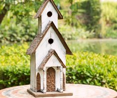 a bird house sitting on top of a table