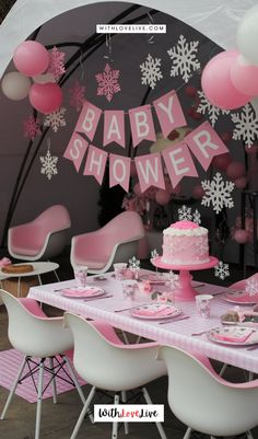 a baby shower party with pink and white decorations