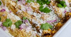 an enchilada dish is topped with cilantro and parmesan