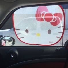 a hello kitty window sticker on the side of a car