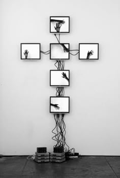 a black and white photo of four square frames connected to each other