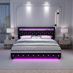 a bed with purple lights on the headboard and foot board in a white room