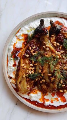 a white plate topped with food on top of a table