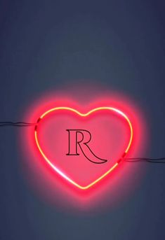 a neon heart with the letter r on it