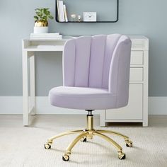 a purple office chair sitting in front of a white desk with a mirror above it