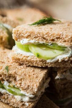 a sandwich with cucumber and cream cheese on it