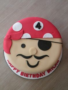 a birthday cake with a pirate face on it