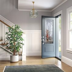 a blue front door in a house with stairs and potted plant next to it