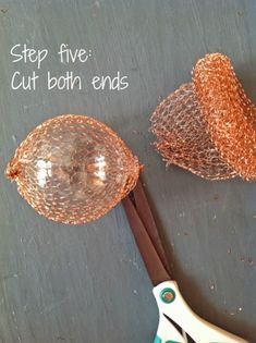 some scissors are sitting on a table next to an orange net and another item that says, step five cut both ends