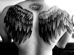 the back of a man's chest with large wings on his upper and lower part